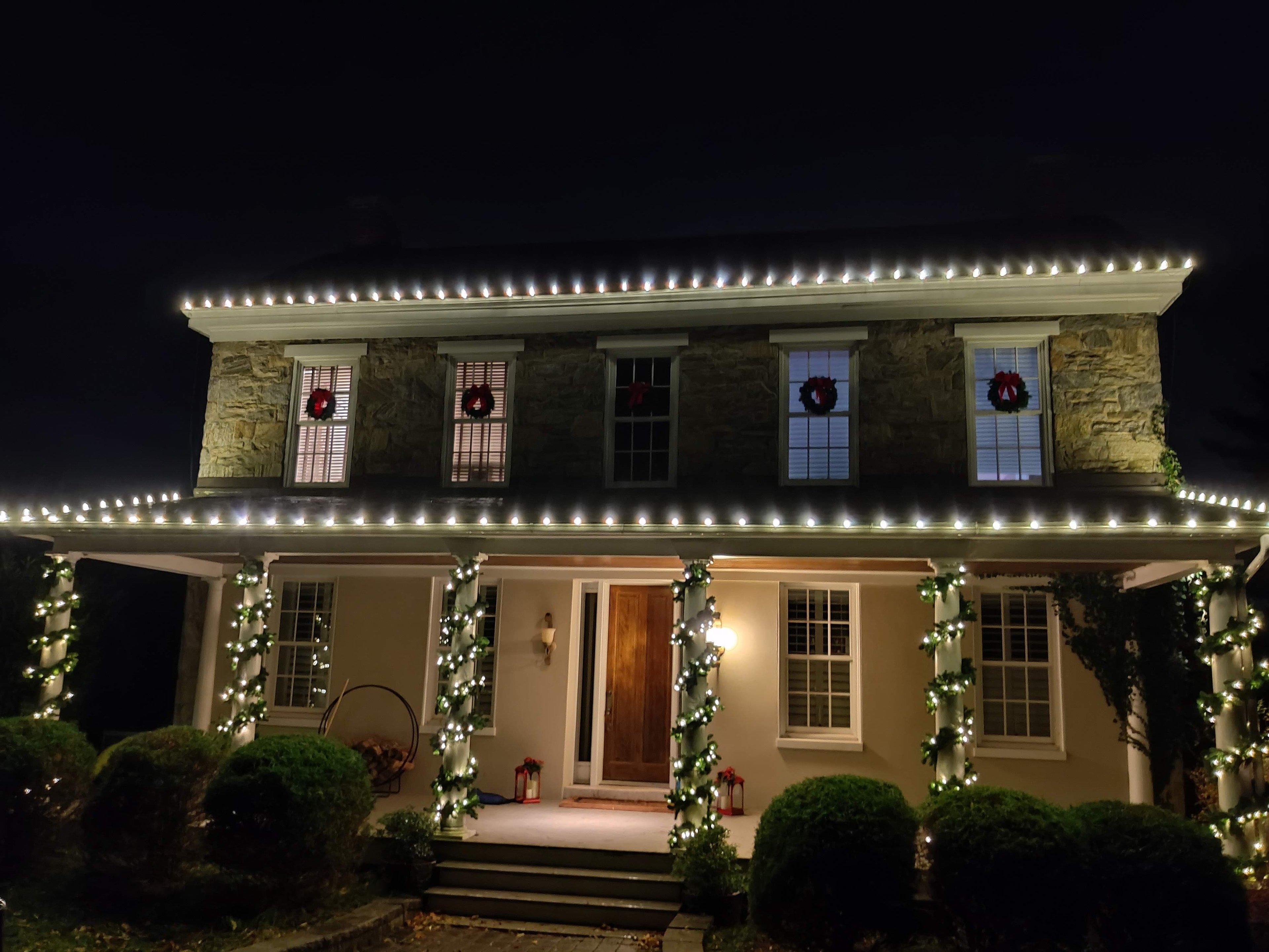 Christmas holiday lights decorating a home at night
