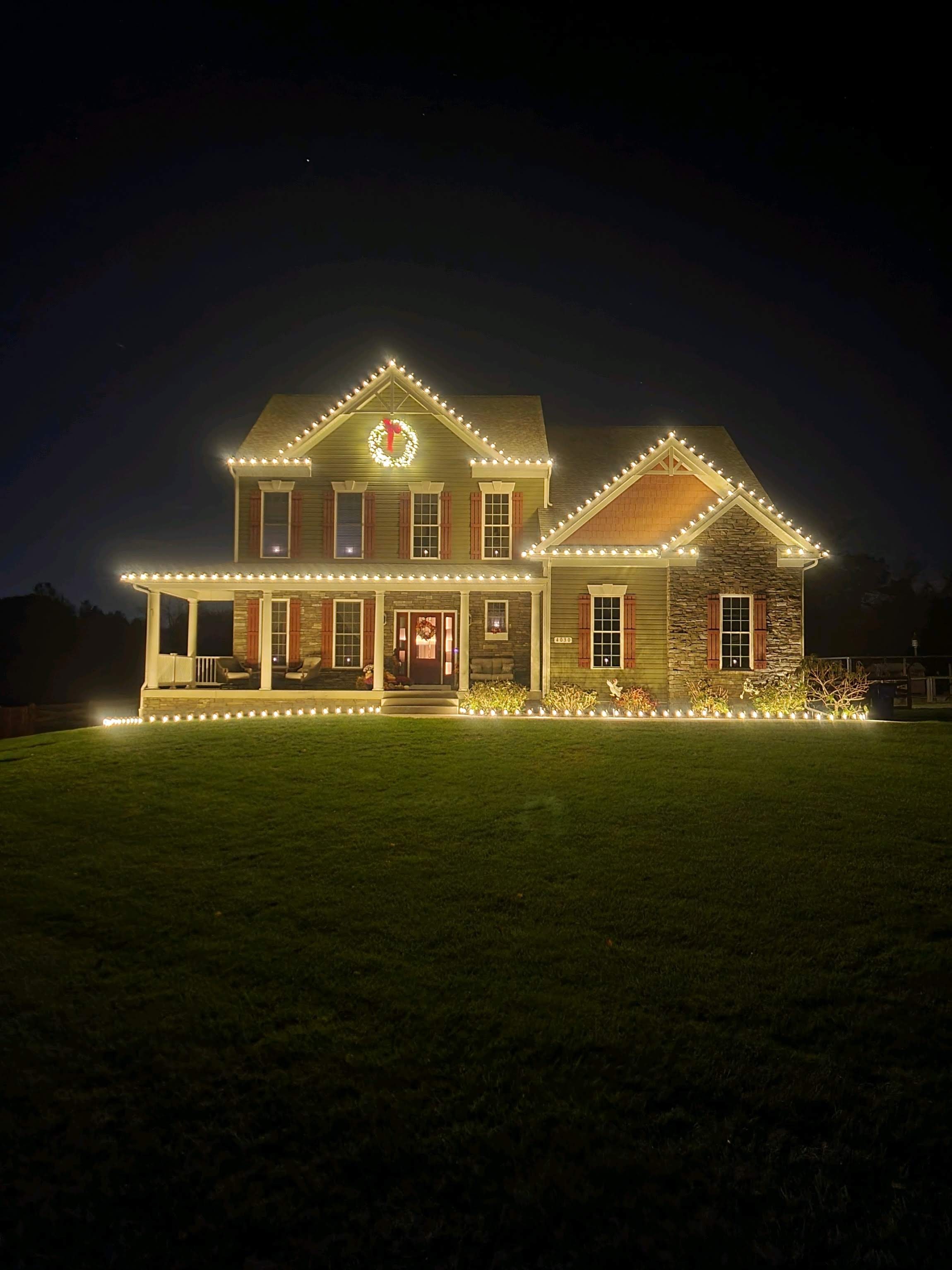Professional roofline holiday lighting installation