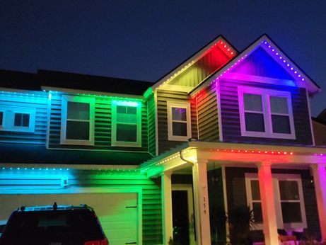 Beautifully illuminated residential home with professional holiday lighting by E.L.F. Designs